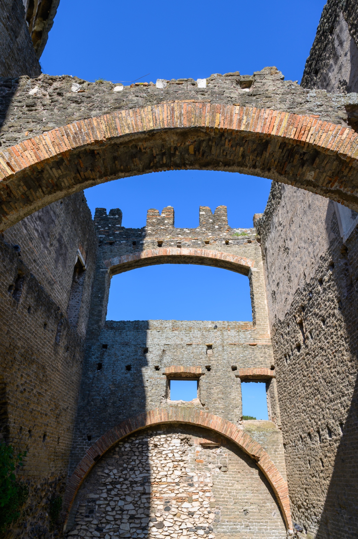 Stone arches and open sky inside the Appian Way ruins