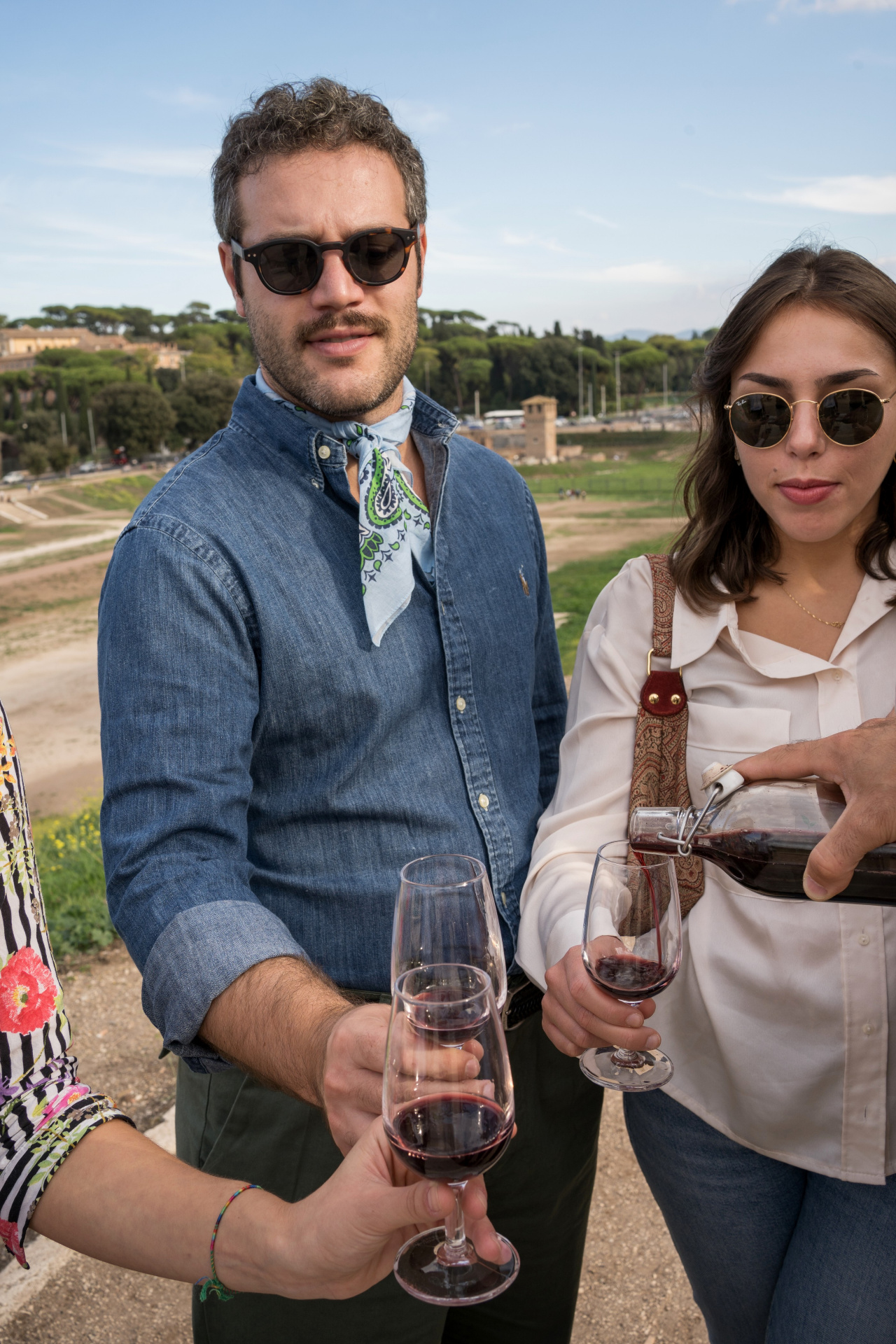 Pouring wine at sunset over Circus Maximus