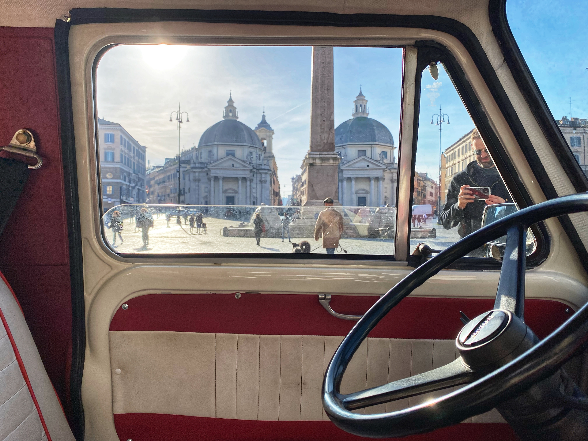 View through the vintage van window onto Piazza del Popolo